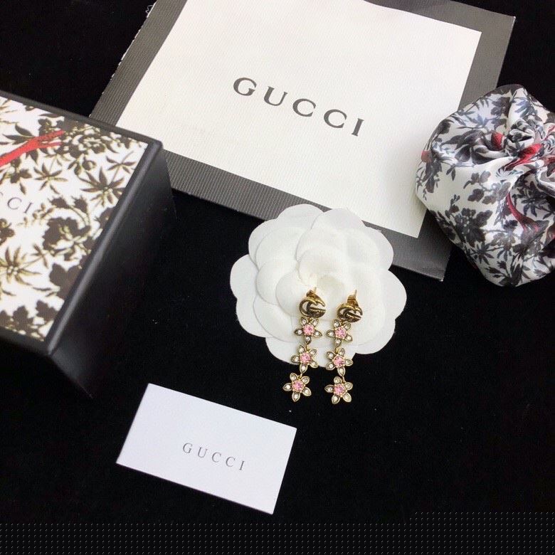 G*u*i earrings